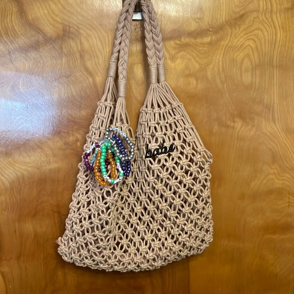 NET BEACH BAG THAT SAYS “BABE.” CUTE! INCLUDES SUNGLASSES, NAILS, & BRACELETS.